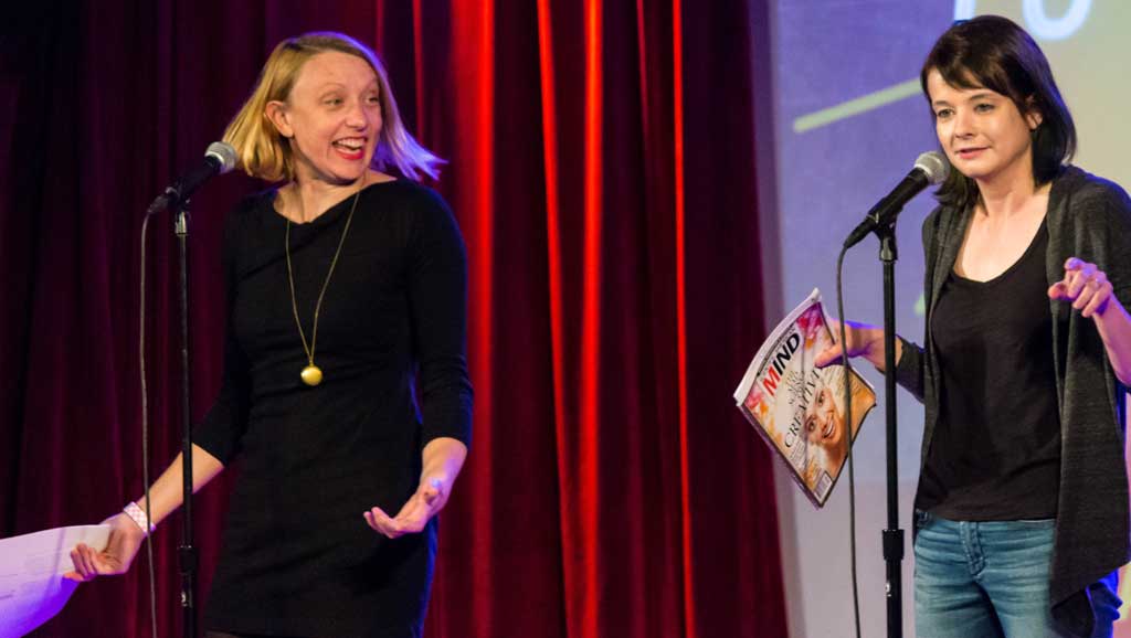 Photo of Croxson on stage at a Story Collider event