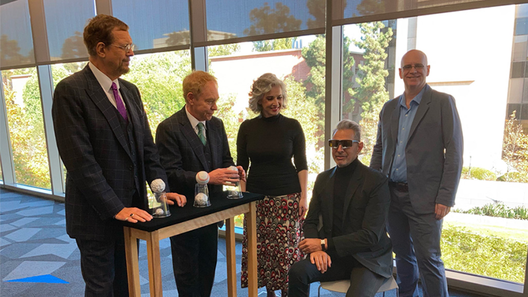 Photo of Macknik with magicians Penn and Teller and researchers