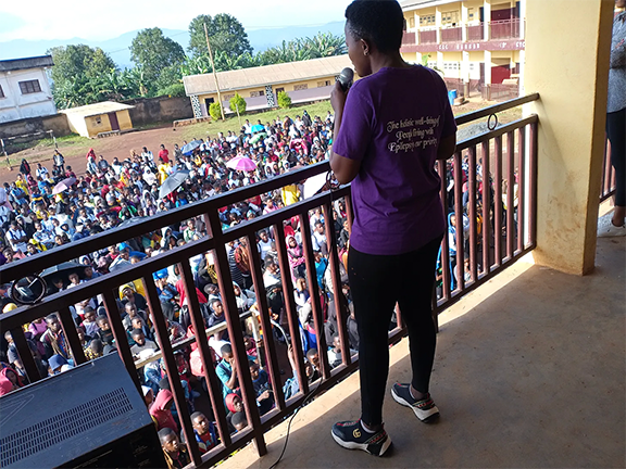 Speaker standing on a balcony addressing crowd